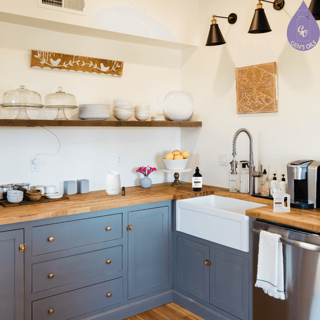A kitchen with a diffuser & essential oil, Clean Dishwashing liquid & Clean Dishwashing powder on the bench.