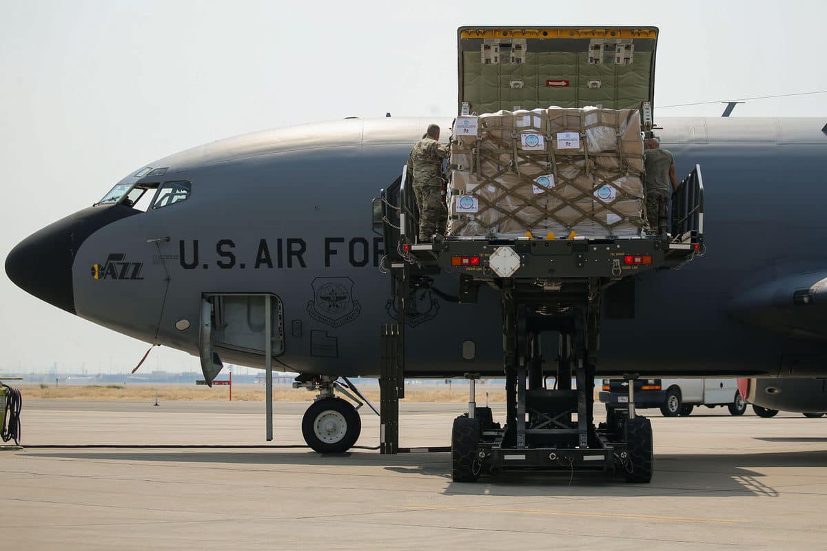 A helicopter being loaded up with emergency supplies for Nepal.