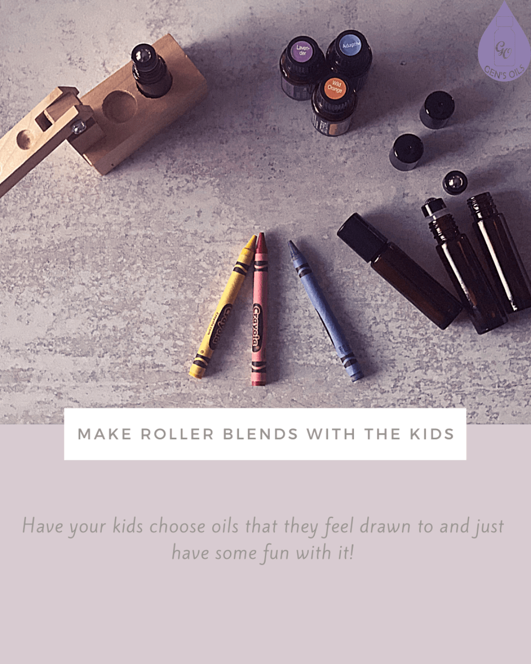 A wooden holder with essential oil bottles, roller bottles, and three crayons on a textured surface, with text overlay reading "MAKE ROLLER BLENDS WITH THE KIDS".