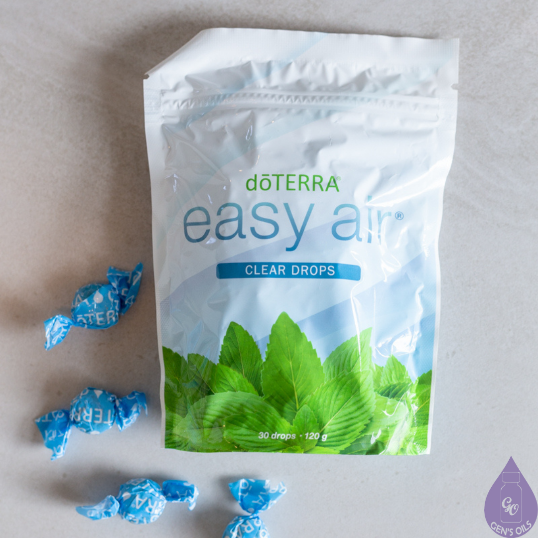 A packet of Easy Air Clear drops with some loose beside it.