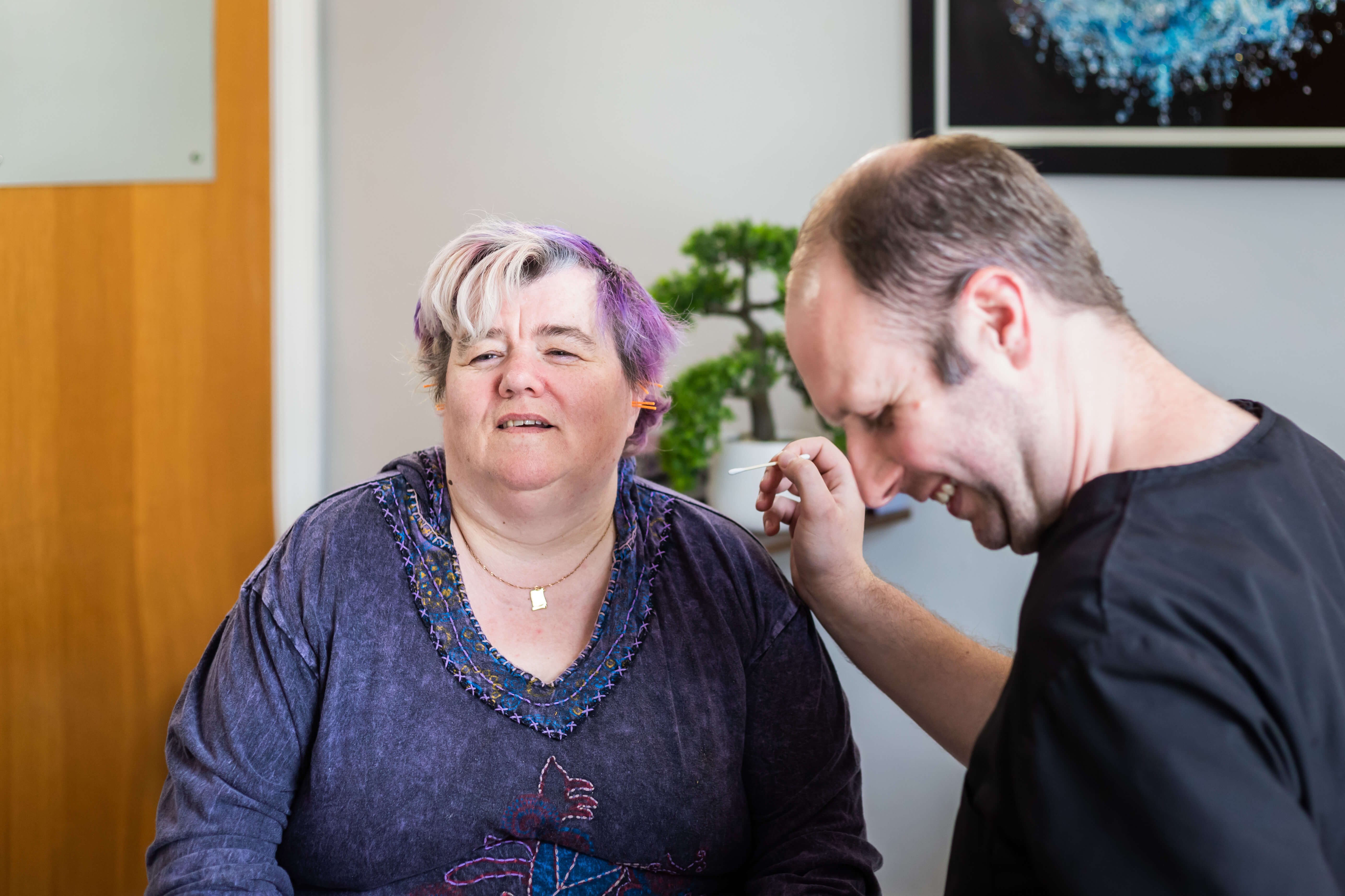 Anthony delivering an ear acupuncture treatment at the clinic in Middlesbrough