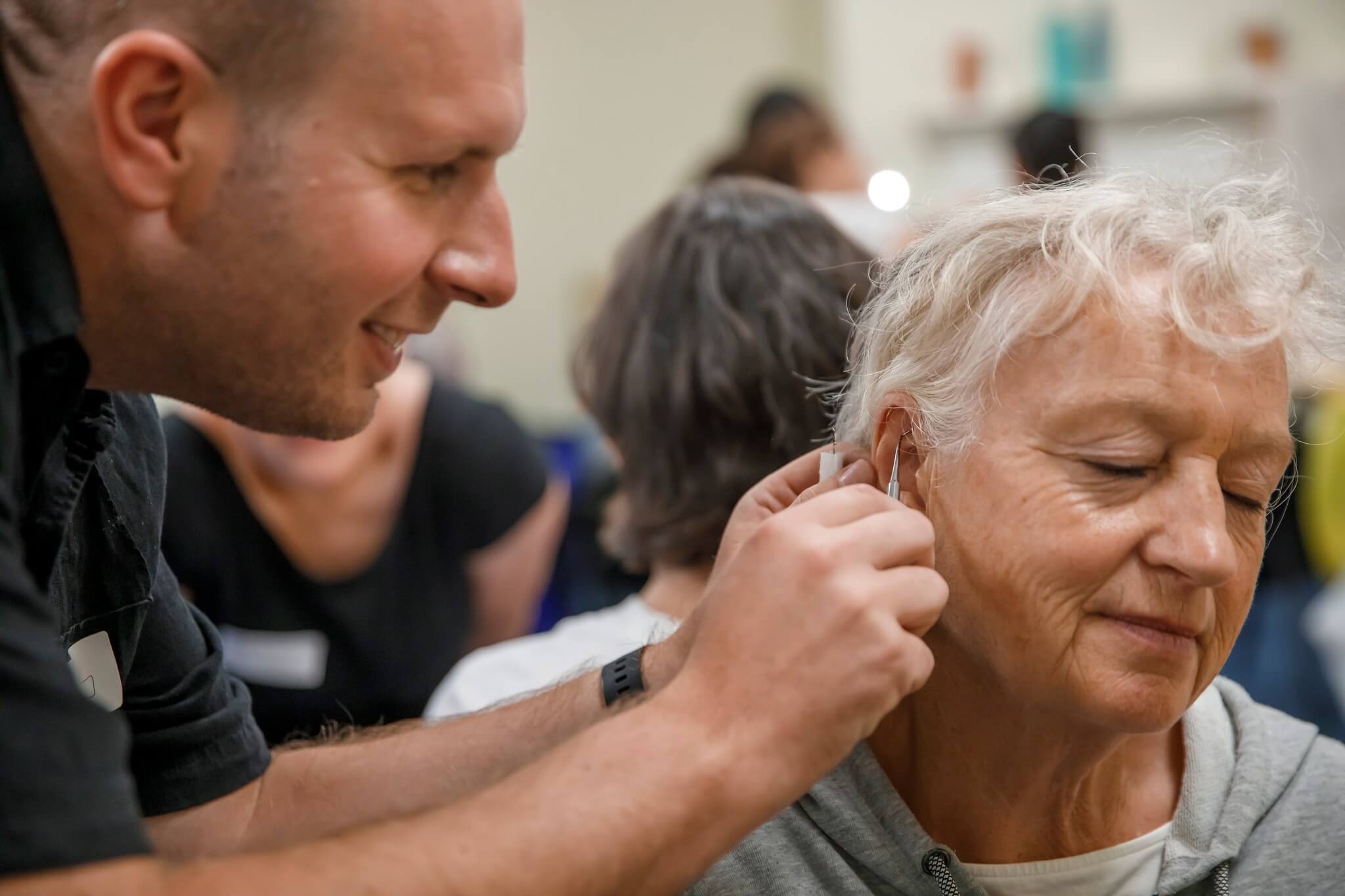 Anthony applying ear seeds to a patient at Deanna Thomas Acupuncture Middlesbrough