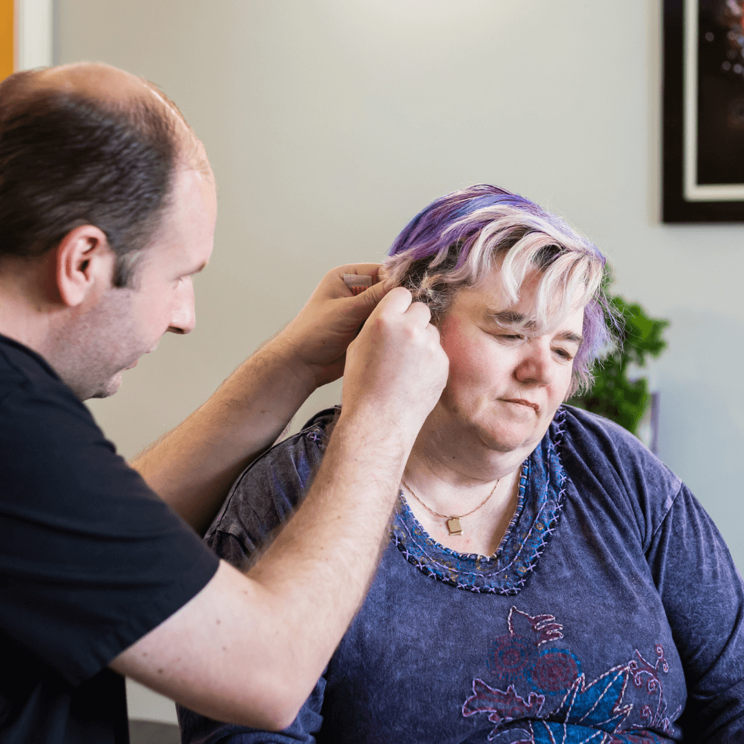 Anthony Thomas performing NADA auricular acupuncture at Deanna Thomas Acupuncture and Wellbeing clinic in Middlesbrough