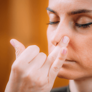 Alternate nostril breathing technique Nadi Shodhana demonstrated to balance the nervous system and relieve nasal congestion naturally