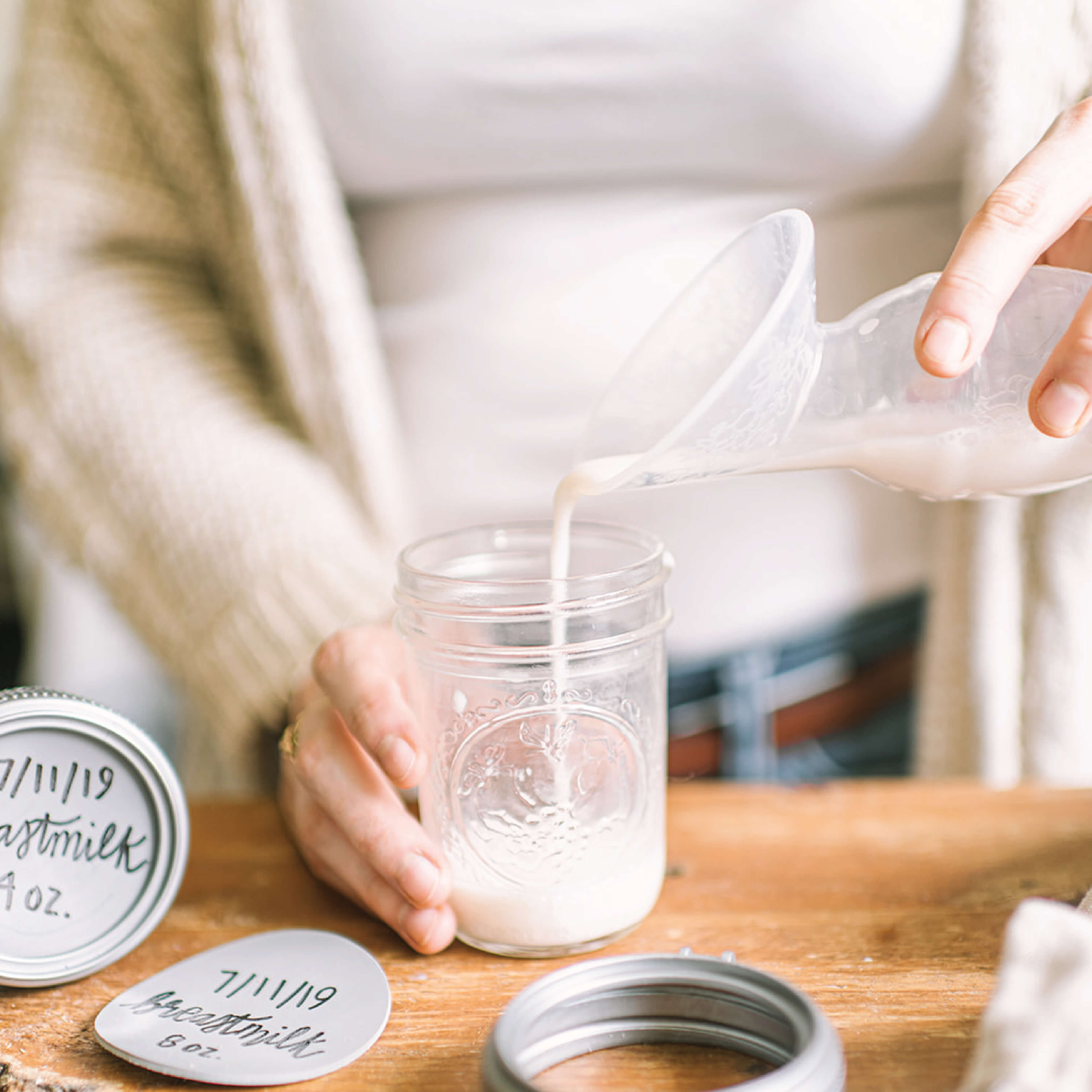 milk pouring into bottle