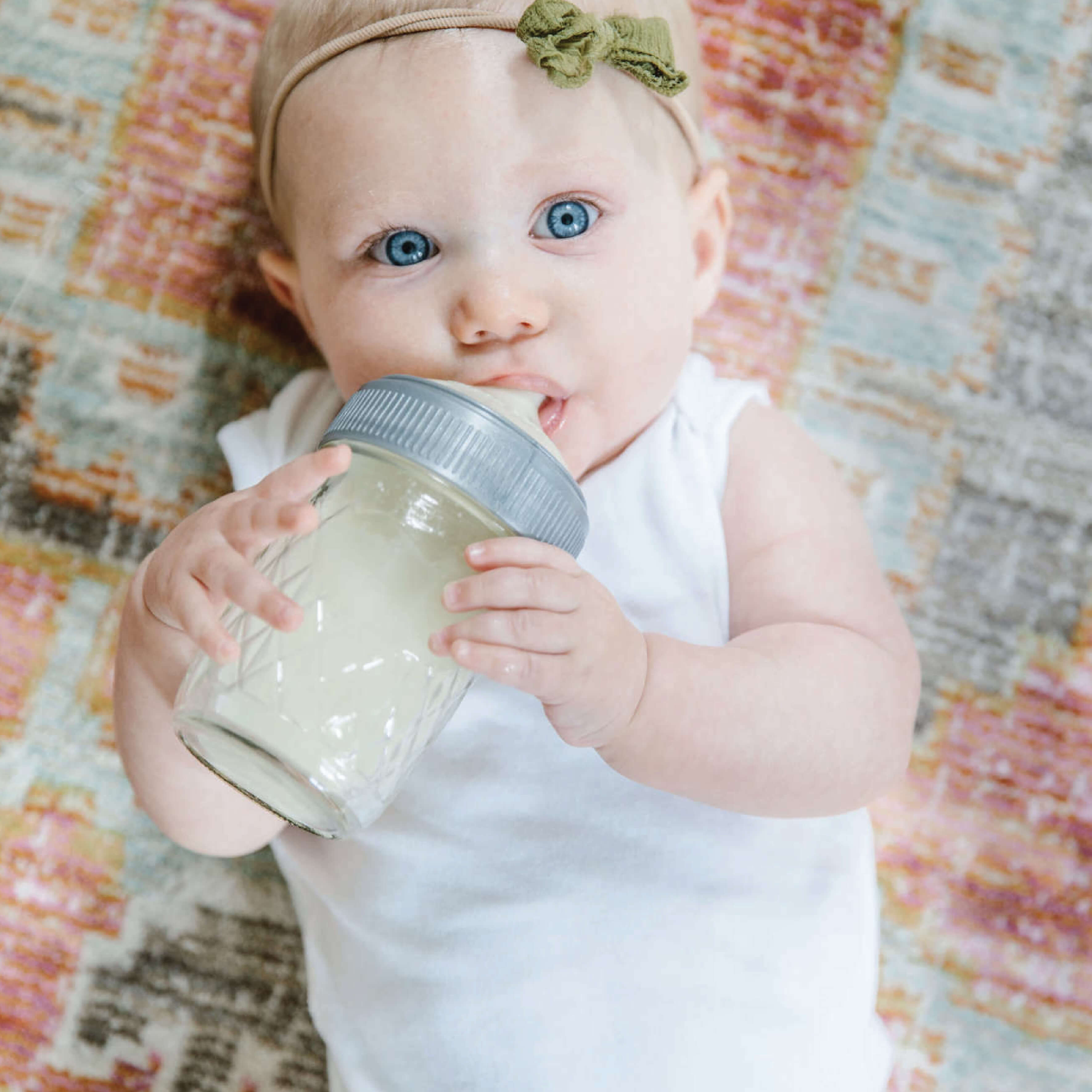baby drinking milk from a bottle