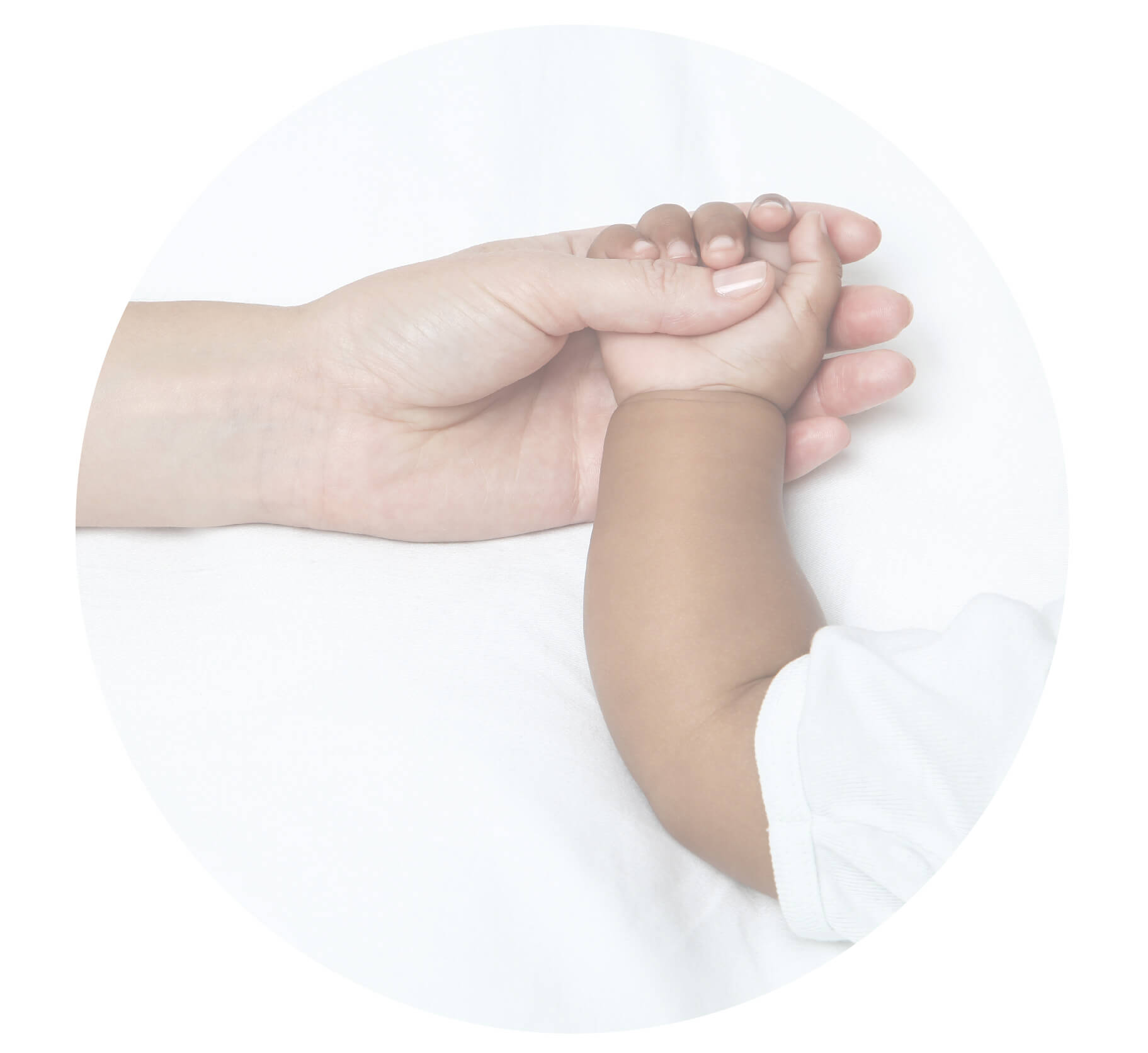 woman holding a babies hand