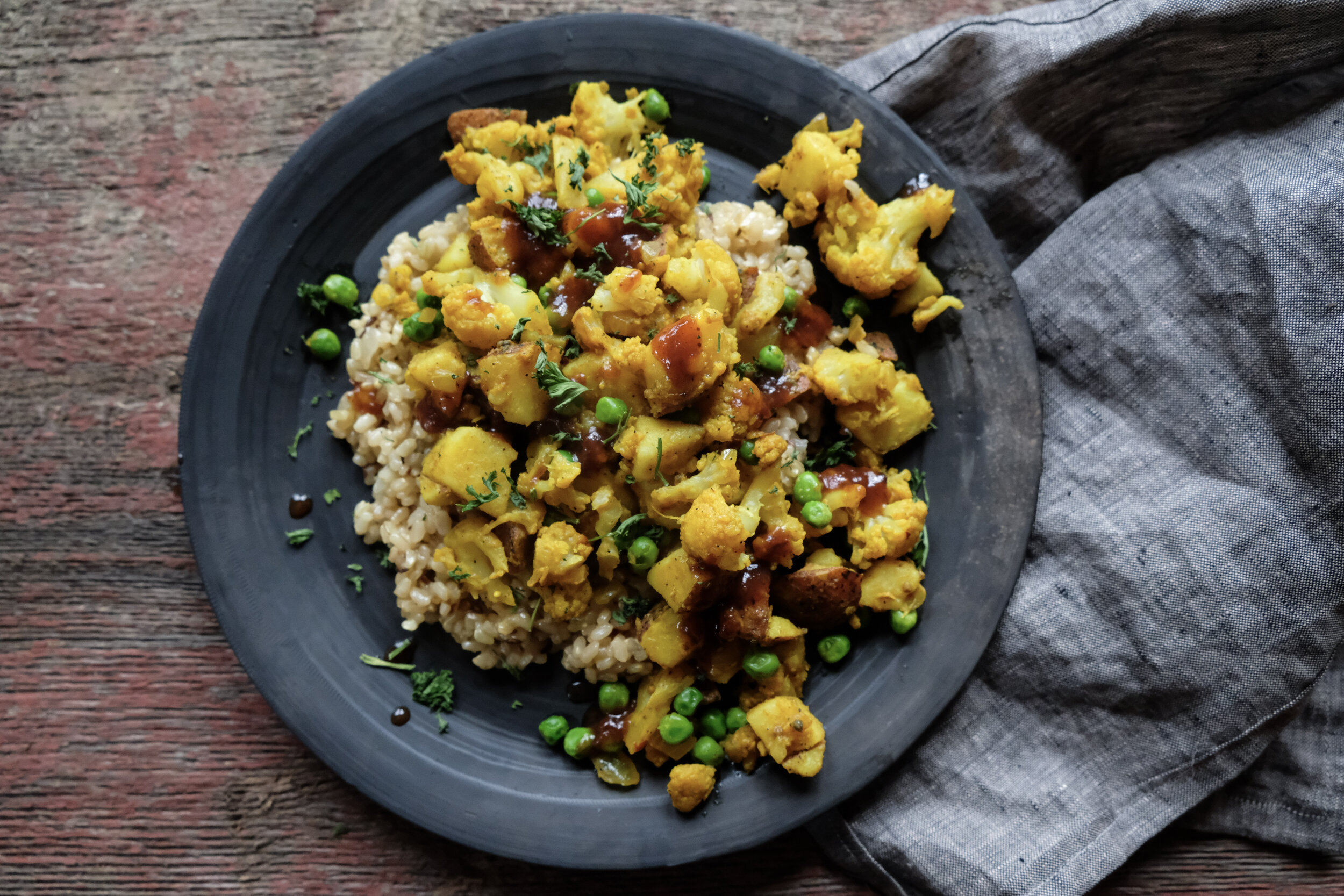 pictured served over Indian spiced rice (recipe coming soon), topped with tamarind (I keep leftover condiments from take-out in my fridge), with a sneak peak appearance of beautiful linen napkin locally made in Brattleboro VT by Amsonia Made