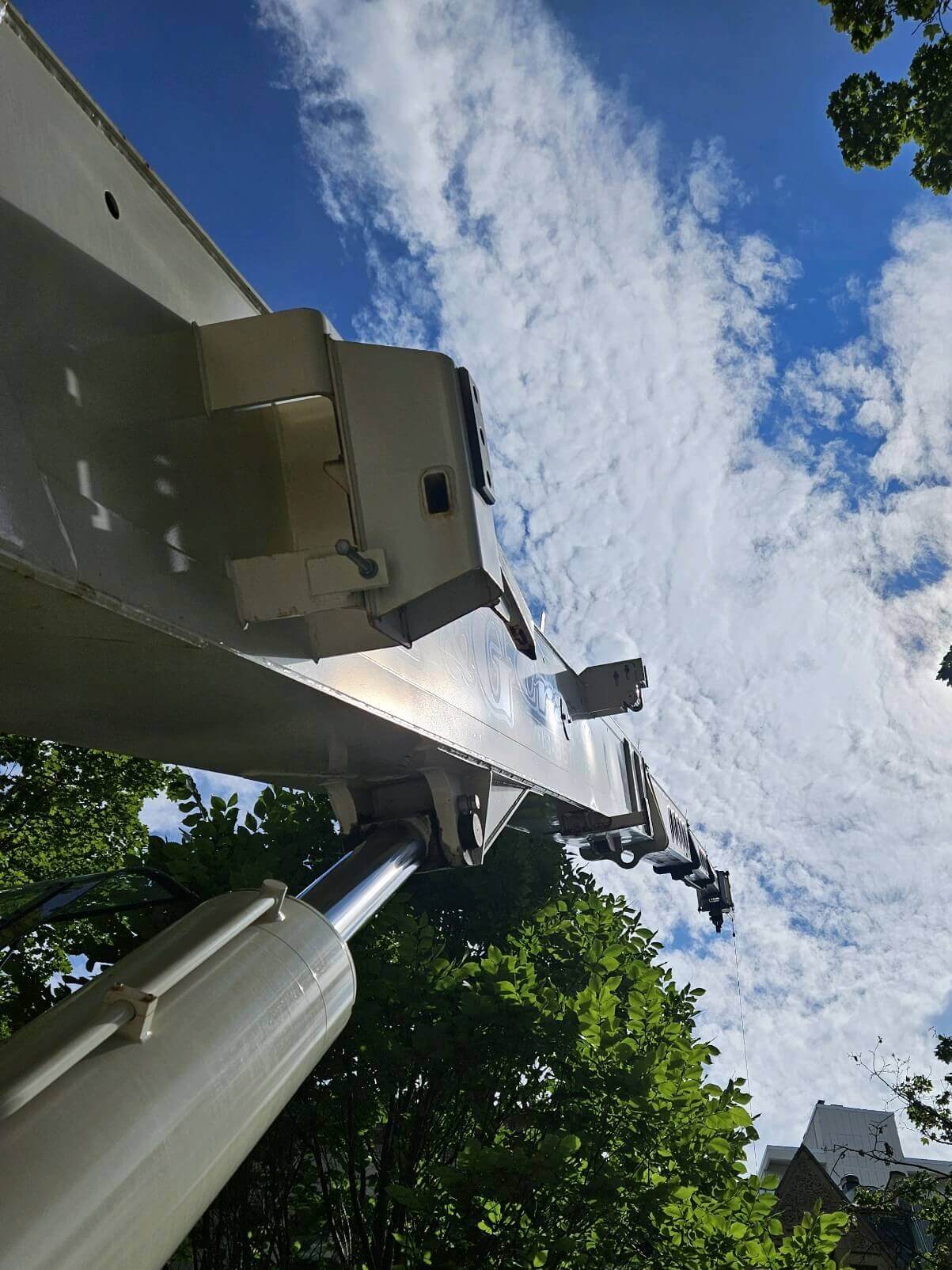 Side view of a crane boomed up.