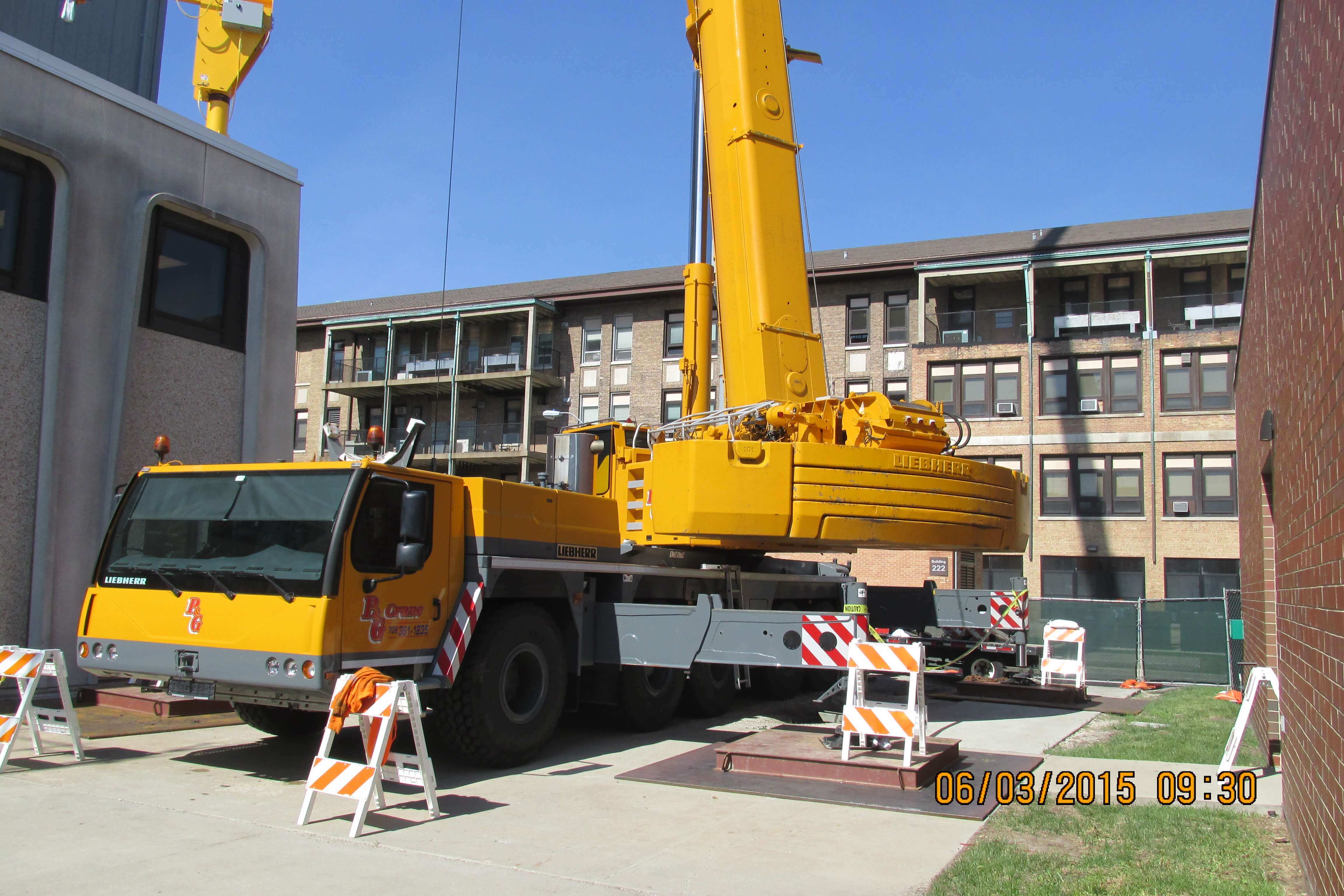 Crane all set up next to hospital.