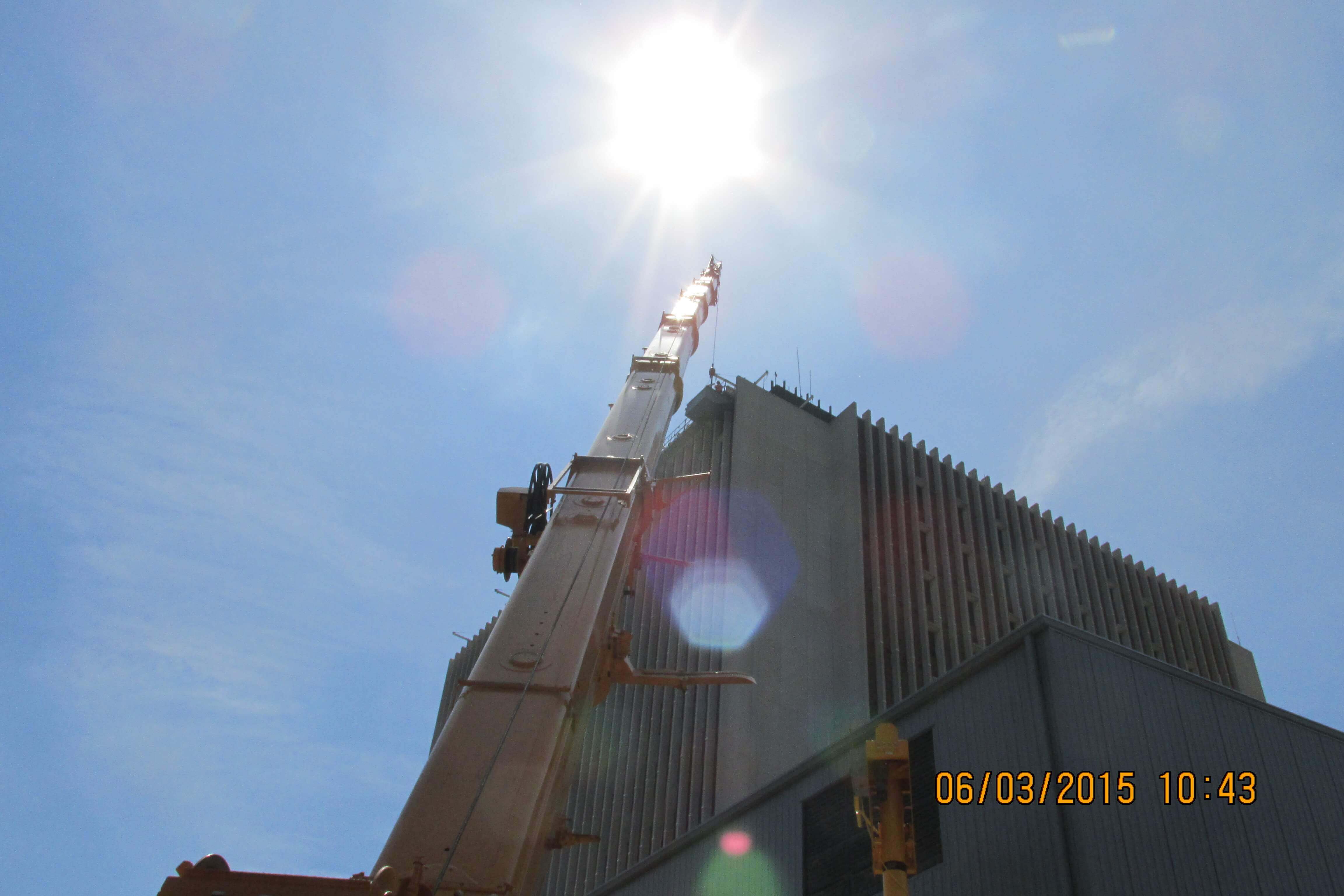 Crane boomed up next to hospital.