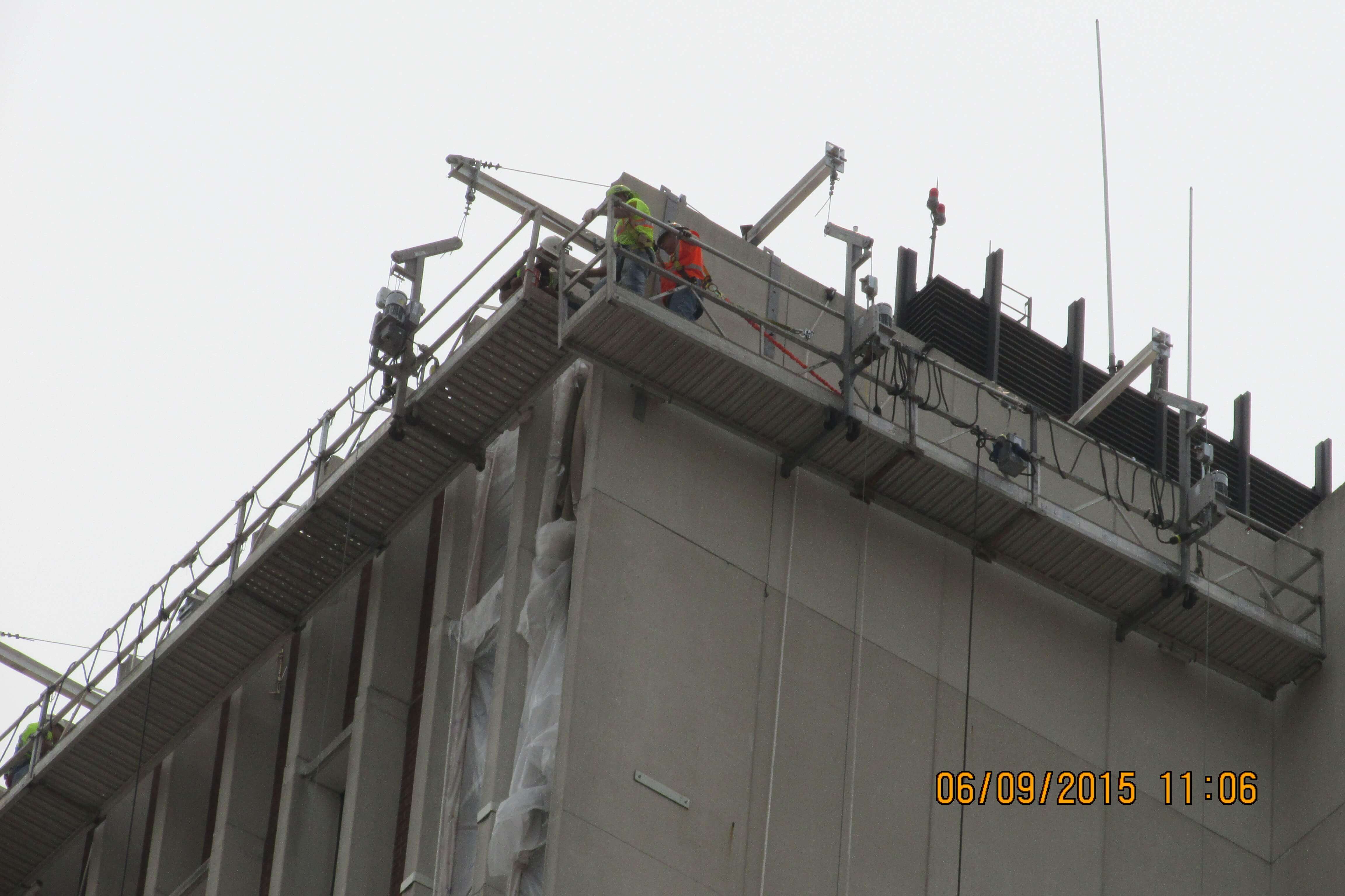 Close up of scaffolding close to the top of building.