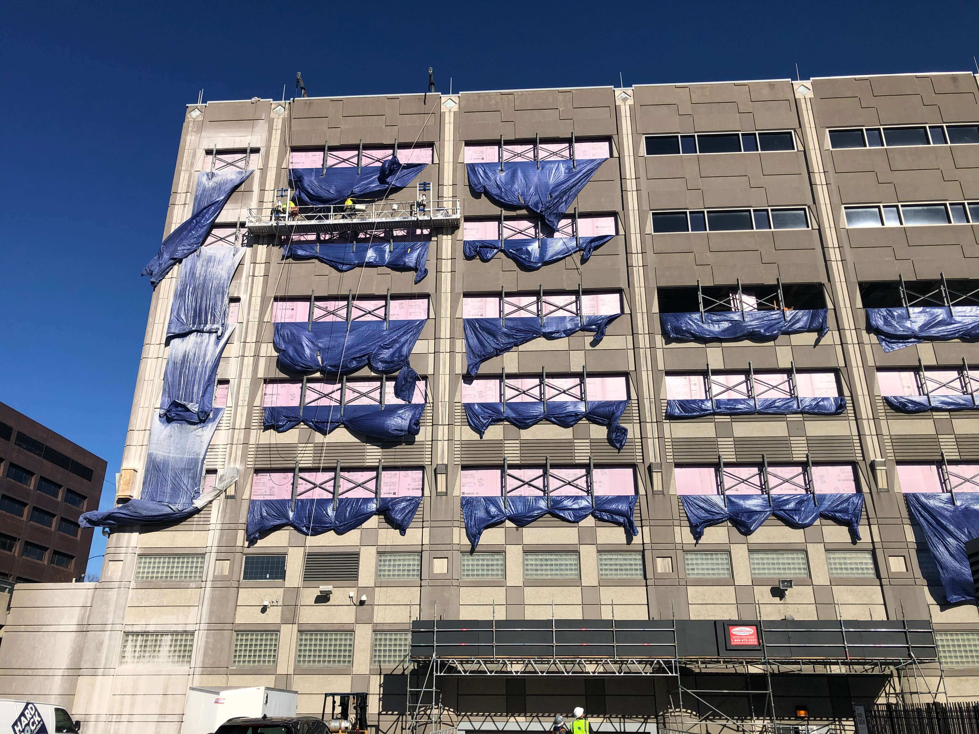 Side of building under construction.