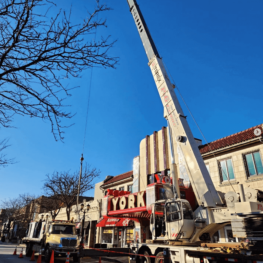 Crane boomed up next to a theater.