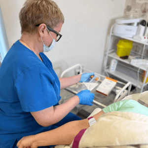 "Helena consulting and administering a PRP facial treatment to a client at Helena Aesthetics Clinic in Middlesbrough."